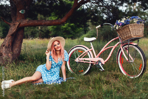 beautiful girl in dress with ladies bicycle 