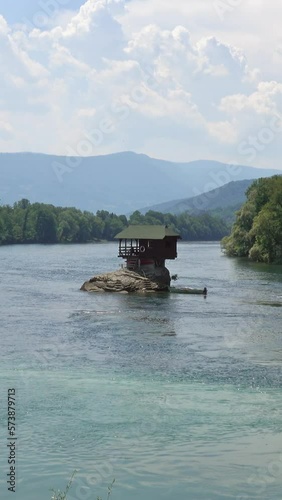 Lonely house on the Drina river in Bajina Basta, Serbia. Vertical video photo