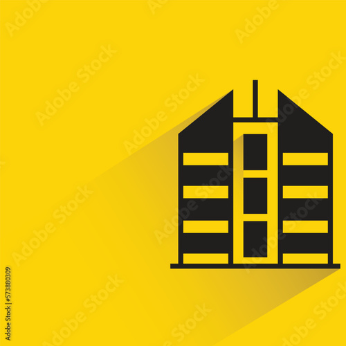 city building with shadow on yellow background