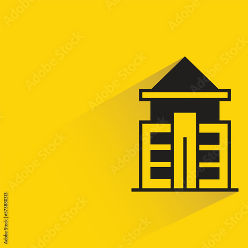 city building with shadow on yellow background