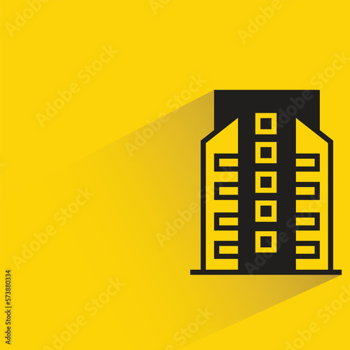 city building with shadow on yellow background