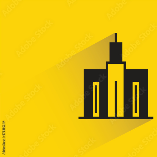 city building with shadow on yellow background