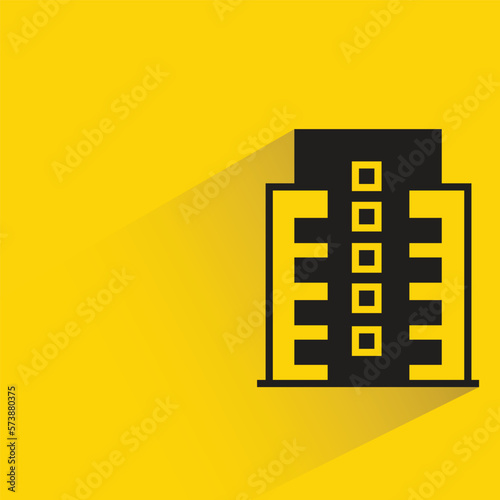city building with shadow on yellow background