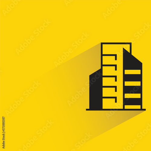 city building with shadow on yellow background