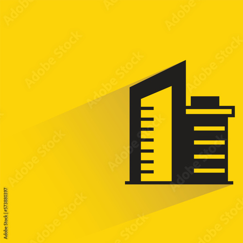 city building with shadow on yellow background