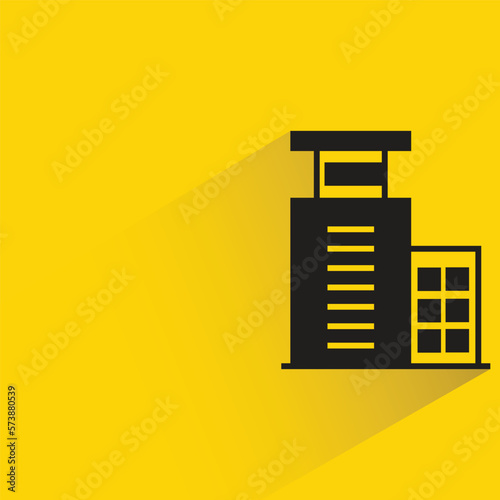 office building with shadow on yellow background