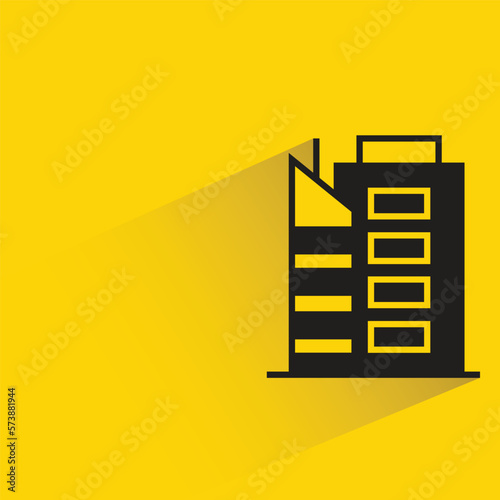 office building with shadow on yellow background