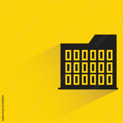 office building with shadow on yellow background
