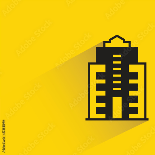 office building with shadow on yellow background