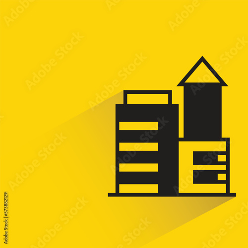 office building with shadow on yellow background