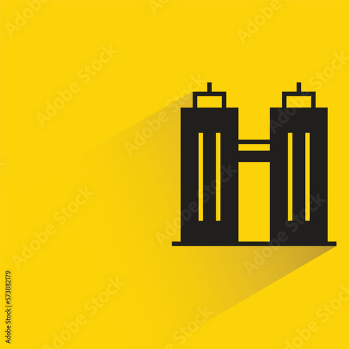 office building with shadow on yellow background