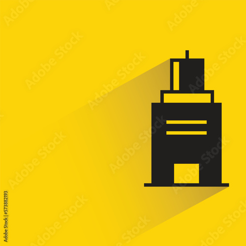 office building with shadow on yellow background