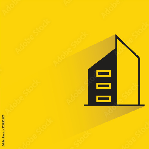 office building with shadow on yellow background