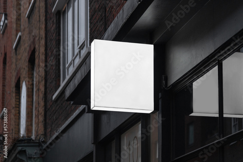 Blank square lightbox sign mockup in the urban environment, empty space to display your advertising or branding campaign