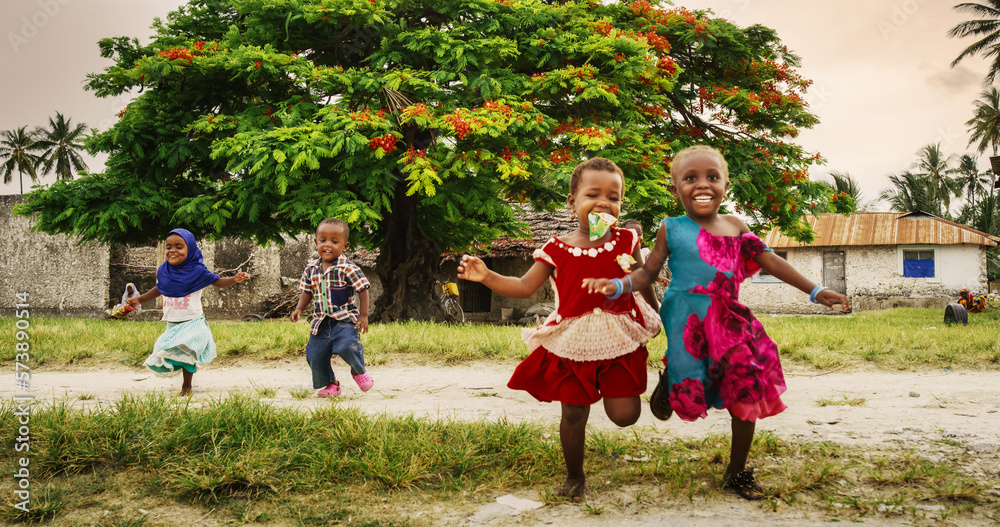 Φωτογραφία Group of African Little Children Running Towards the Camera and Laughing in Rural Village