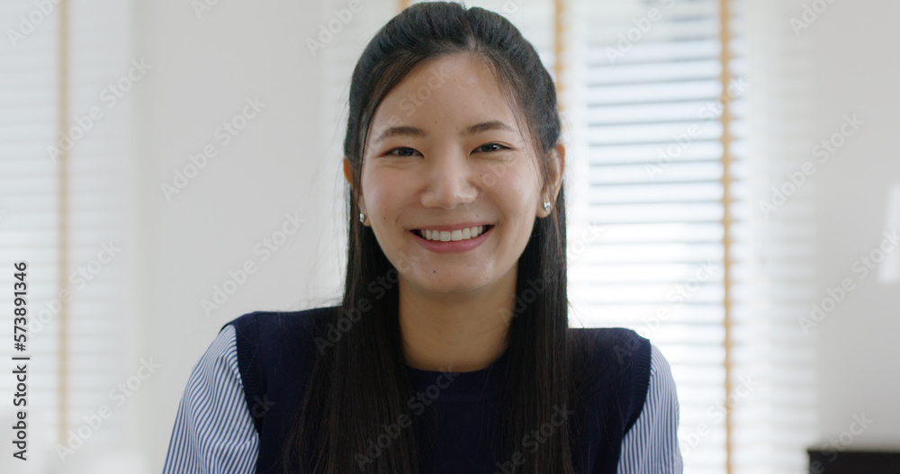 Asia people young casual woman sit smile work at table desk home workspace self learn on laptop in modern workforce reskill career upskill job data analyst MBA lesson. Happy face girl look at camera. Asia people young casual woman sit smile work at table desk home workspace self learn on laptop in modern workforce reskill career upskill job data analyst MBA lesson. Happy face girl look at camera.