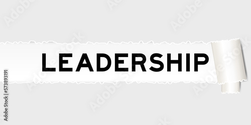Ripped gray paper background that have word leadership under torn part