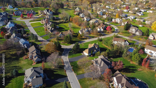 Colorful low-density residential living suburban neighborhood with autumn leaves and grassy yards landscaping in Rochester, Upstate New York, USA