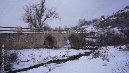 Ancient bridge with arched stone architecture from Byzantine period in Voskopoja Albania photo