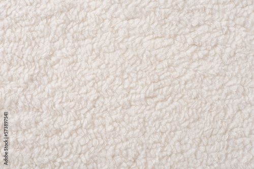 white plush fabric texture background , background pattern of soft warm material photo