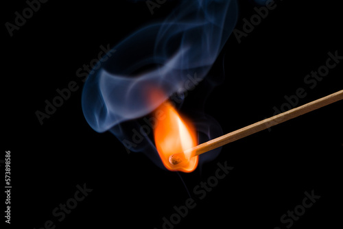 Lighting matches at the moment when it explodes. Burning match on black background. 