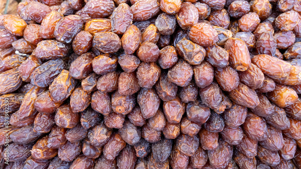 The surface texture of selected dried dates. Natural oriental sweets. Phoenix dactylifera (Medjool)