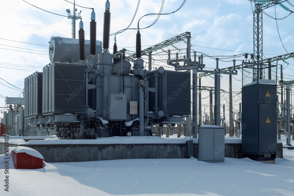 High voltage transformer substation in winter. Stock Photo | Adobe Stock