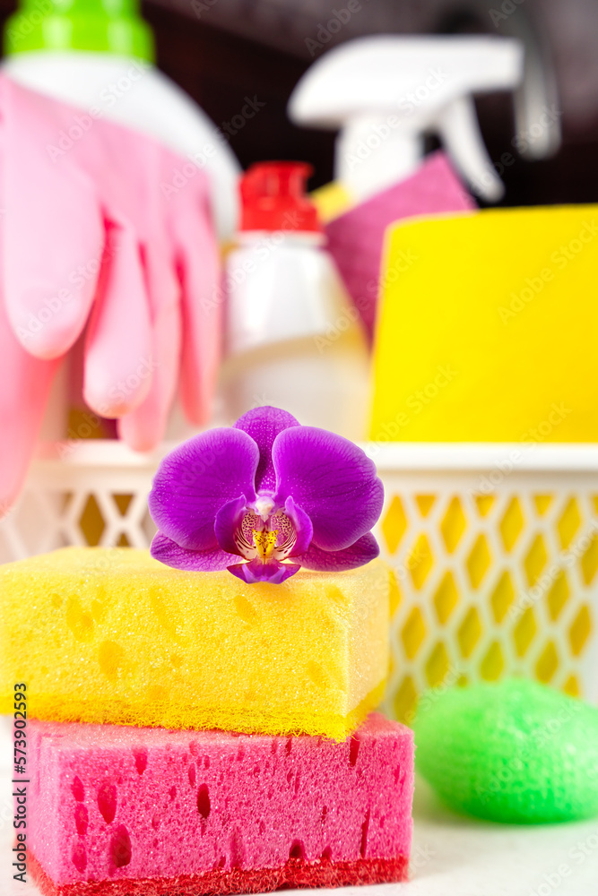 Concept of spring cleaning. Cleaning items in a bucket on the table. Eco-friendly cleaning products. Close-up. Selective focus. Concept of spring cleaning. Cleaning items in a bucket on the table. Eco-friendly cleaning products. Close-up. Selective focus.