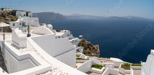 Panoramic view, balconies and roof tops in the village of Oia, Santorini. Architecture and landscape of Greece. Touristic magazine concept