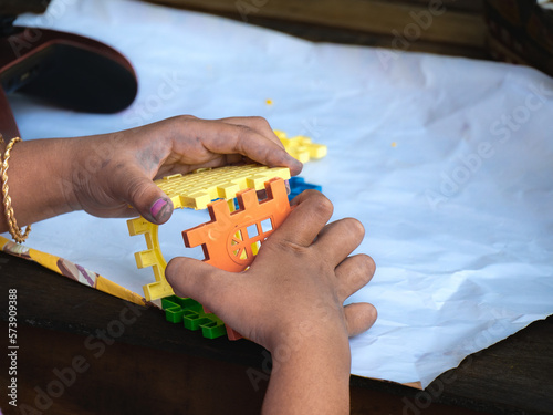 hands of a person playing a puzzle