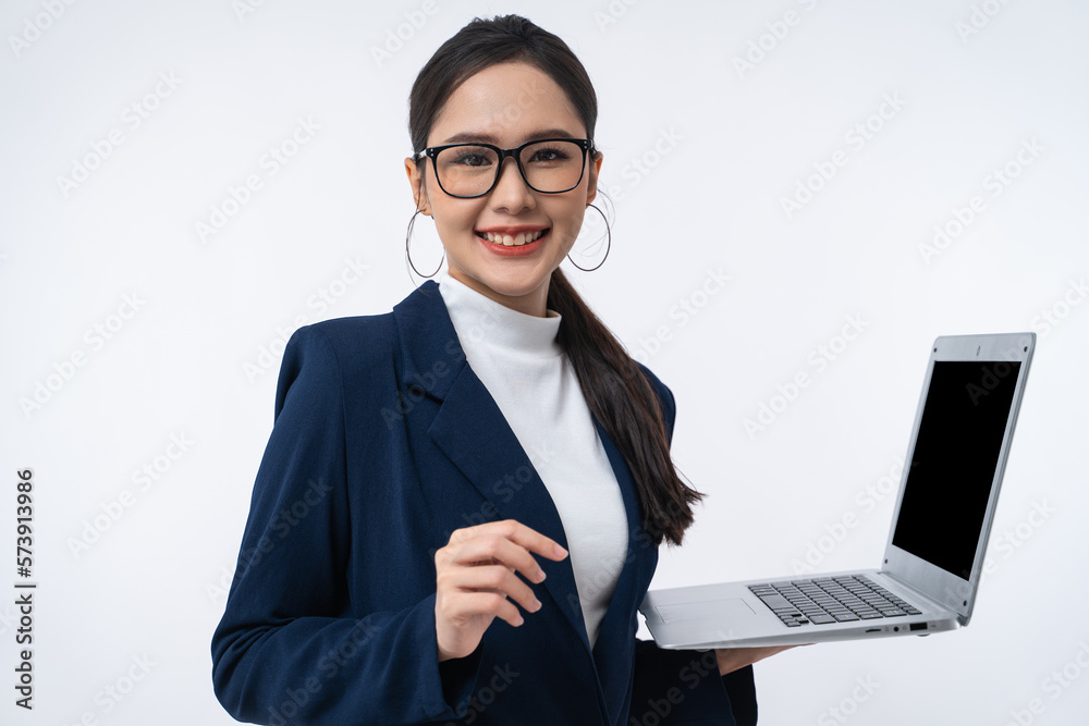 Happy young Asian businesswoman in a glasses with smile holding laptop computer isolated on white background. Happy young Asian businesswoman in a glasses with smile holding laptop computer isolated on white background.