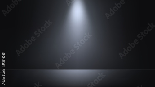 Black studio background with spotlight