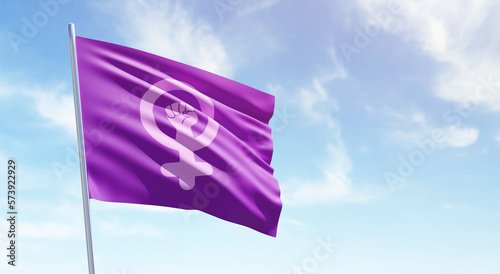Quadro em tela Feminist flag on a blue sky and copy space for international women's day and feminist activism in 3D illustration