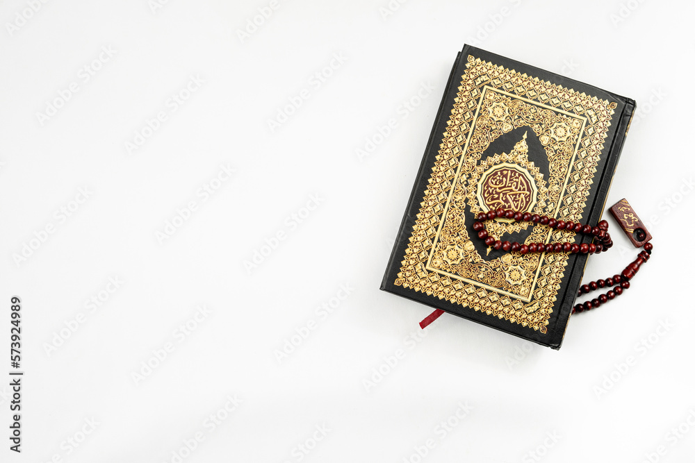 Holy Quran and rosary isolated for banner Holy Quran and rosary isolated for banner
