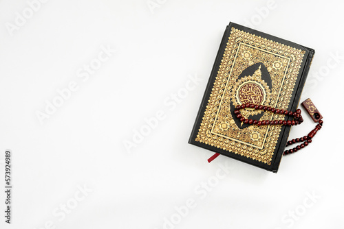 Holy Quran and rosary isolated for banner