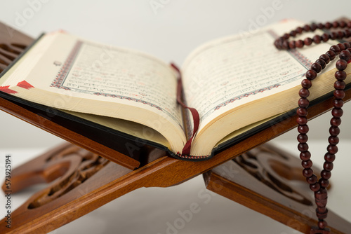 Open old Quran book on a table