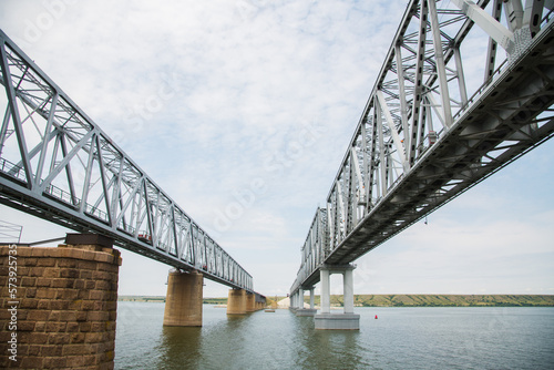 Large metal railway bridge across the river