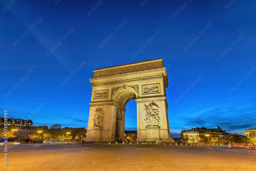 Paris France night city skyline at Arc de Triomphe and Champs Elysees