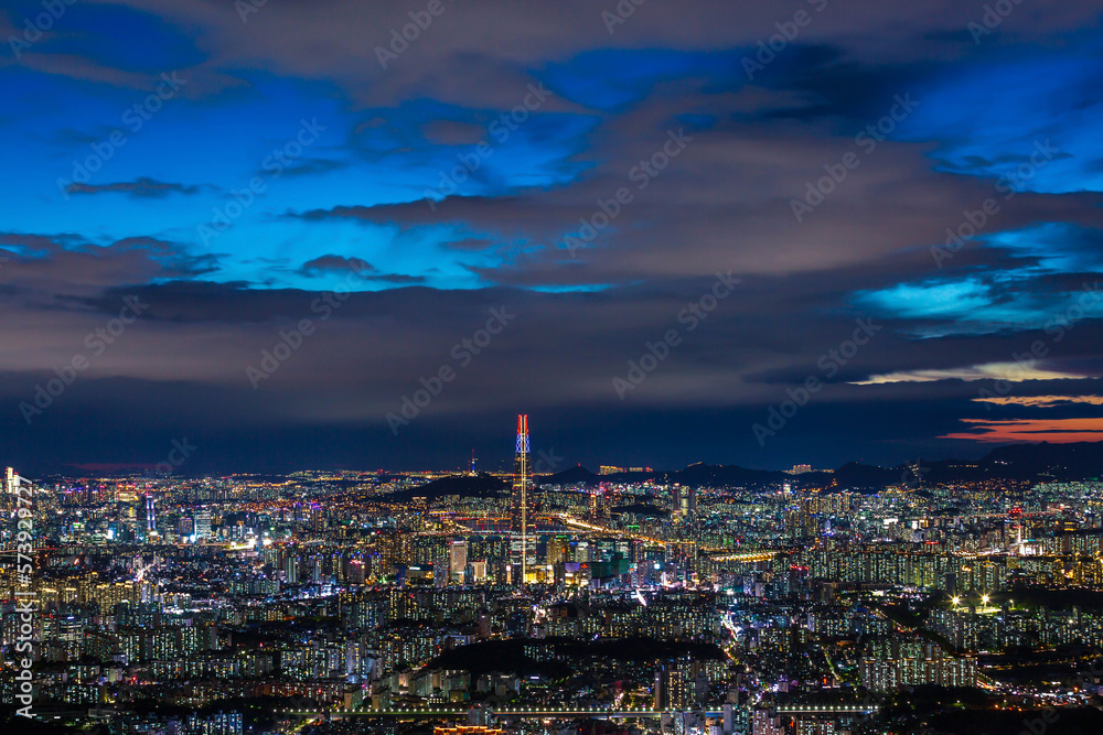 Fototapeta premium Seoul City skyline and downtown and skyscraper at night is The best view and beautiful of South Korea at Namhansanseong mountain.
