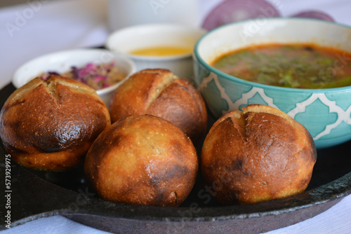 Close up of roasted dal baati churma-a traditional north Indian cuisine in a cast iron plate