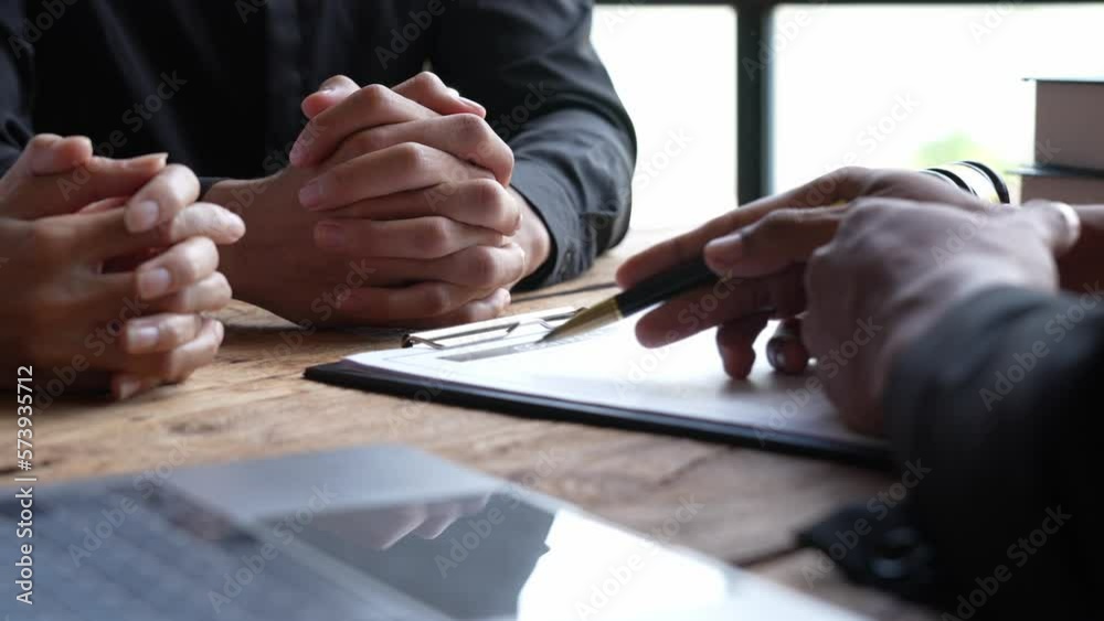 Attorneys or lawyers who are reading the statute of limitations Consultation between male lawyers and business clients, tax and legal and legal services firms.