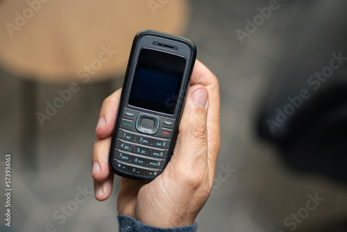 Old school PDA device with stylus from early 2000s and millennium 