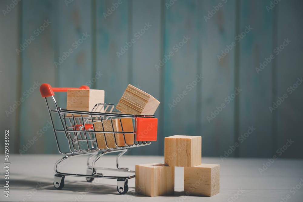 Shopping online. Boxes in a trolley on a table. Business retail shop store marketing online. Shipping service technology, order check out website, home delivery package, client buying on e-commerce.