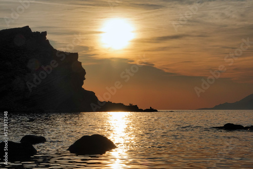 Samothrace island from G  k  eada Arcadia Beach- Imbros Island at sunset  with cliffs  mountain  sky view. Aegean sea sunset view across to the Semadirek  Samothace island Greece and Turkey