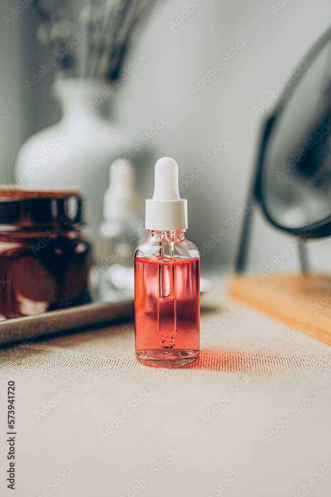 Glass bottle of cosmetic product. Skincare concept. Glass bottle of cosmetic product. Skincare concept.