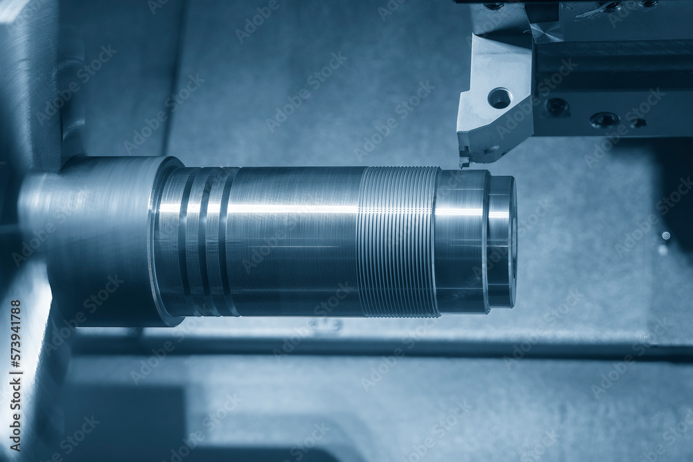 The CNC lathe machine thread cutting at the metal shaft parts. The CNC lathe machine thread cutting at the metal shaft parts.