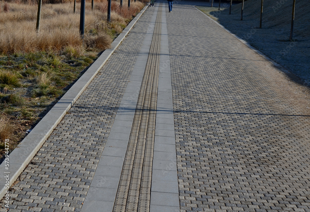 lane in paving forblind. the protrusions on tiles guide the foot to the pedestrian crossing and in a safe direction and distance from the road. it protects blind citizens in the city and help move lane in paving forblind. the protrusions on tiles guide the foot to the pedestrian crossing and in a safe direction and distance from the road. it protects blind citizens in the city and help move