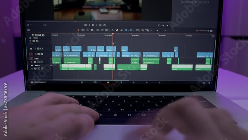Timelapse of the editor's work on a laptop at home. Creates a creative video clip for film production. The interface of the program for video color correction. Makes a video blog for social networks