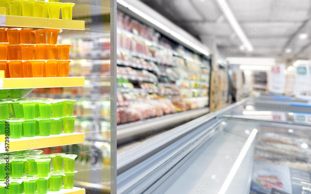 Fototapeta premium Abstract blurred supermarket. choosing a dairy products at supermarket.