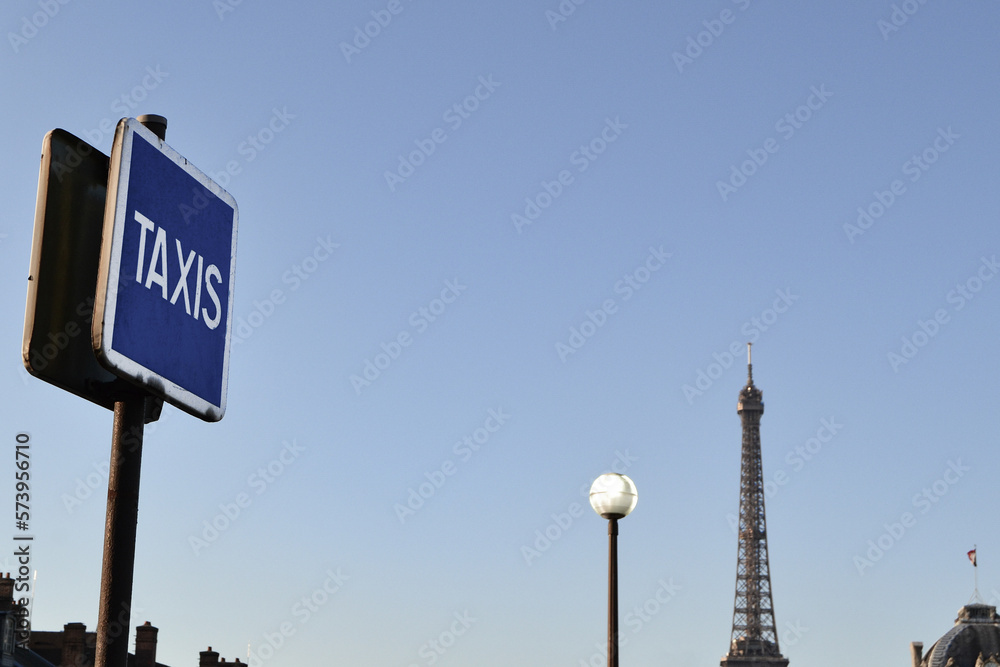 Paris skyline at morning with urban elements such as: a taxi sign, chimneys, street light. Paris skyline at morning with urban elements such as: a taxi sign, chimneys, street light.